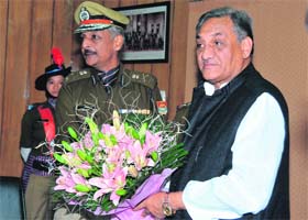 Chief Minister Vijay Bahuguna being welcomed by DGP Satyavrat Bansal during a police review meeting in Dehradun on Saturday