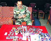Army recruitment office in charge B. Patnaik looks at contraband drugs which were seized from some candidates at a recruitment drive held in Rohtak on Saturday