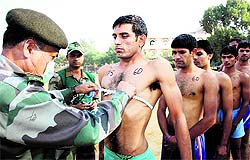 A candidate is physically examined by the authorities. Photos: Manoj Dhaka