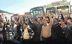 Employees of the Himachal Road Transport Corporation raise slogans at a gate meeting at the old bus stand in Shimla on Saturday