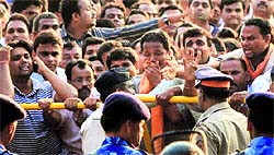 Police tries to control supporters outside the Matoshree after Shiv Sena chief Bal Thackeray died