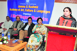 A poet recites her poem during a mushaira organised by the J&K Academy of Art, Culture and Languages in Jammu on Saturday.