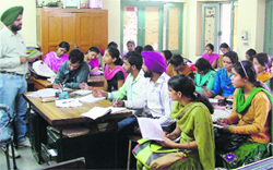An instructor teaches shorthand at Punjabi Bhavan in Ludhiana. Photo: Inderjeet Verma