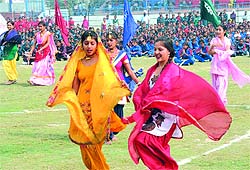 Girls perform a dance at the cultural function held at the sports stadium to mark the inauguration of the Punjab State Rural Games on Sunday