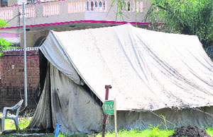 A tent pitched by the security staff of former Punjab Chief Secretary Jai Singh Gill at Sector 6, Panchkula, on Sunday. 