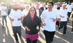 Residents participate in a walkathon at Sukhna Lake on Sunday