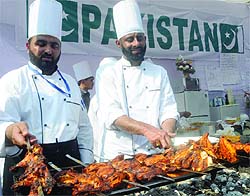 Chefs from Pakistan cook food at the Hotel Ashok in New Delhi on Sunday