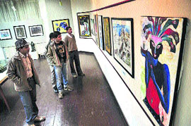 Tourists at an All-India Art Exhibition organised by the Language and Culture Department at the State Museum in Shimla.