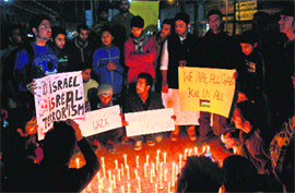 Students of the University of Kashmir protest against Israeli strikes on Gaza, in Srinagar. 
