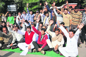Members of the Panthers Party hold a protest outside the Shri Maharaja Gulab Singh Hospital in Jammu on Sunday.