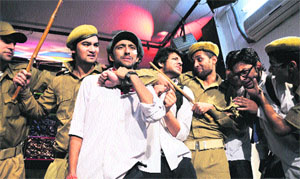 Artistes enact a scene from a Hindi play at Natrang Studio Theatre in Jammu on Sunday. 