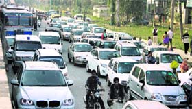 Vehicles of candidates parked outside Khalsa College lead to a traffic jam on the road.