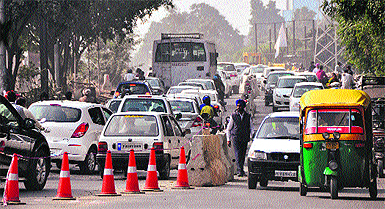 Traffic chaos on Ferozpur Road following traffic restrictions imposed by the police on one side of the Sidhwan Canal bridge in Ludhiana on Sunday. 