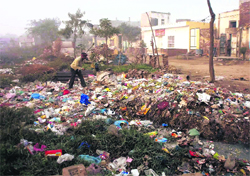 Heaps of garbage not cleared for the past one month in Jugiana village. 