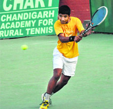 A player in action during the CLTA-AITA Chandigarh Open Mens and Womens Tournament on Monday.