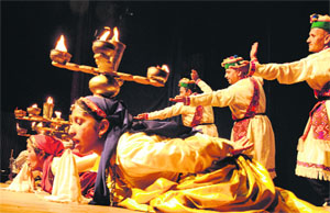 Performers from Himachal Pradesh present a deepak nritya at Punjab Kala Bhavan in Sector 16, Chandigarh, on Monday. 
