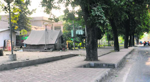 Illegal tent pitched on a greenbelt by security staff of former Punjab Police DIG NS Dhillon at Phase X in Mohali. 