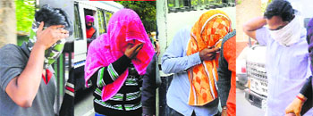 The accused being produced in the district courts on Monday. 