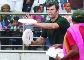 Frisbee player Brodie Smith performs magic trick with a disc at Jawaharal Nehru Stadium in New Delhi on Monday