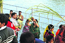Devotees perform rituals during the Chhath puja in Haridwar on Monday. 