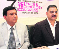 Director General, Uttarakhand Council of Science and Technology, Rajender Dobhal (right), addresses a press conference in Dehradun on Monday.
