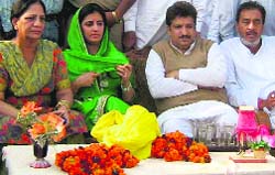 Adampur MLA Renuka Bishnoi (centre) in a village of Fatehabad district on Monday. A Tribune photograph 