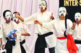 Students perform a street play at Gurgaon.