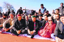 Chief Minister PK Dhumal with HPCC chief Virbhadra Singh and others at the 95th birth anniversary of Indira Gandhi in Shimla on Monday. Photo: Amit Kanwar