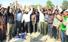 Vegetable and fruit vendors during a protest in Jalandhar on Monday.