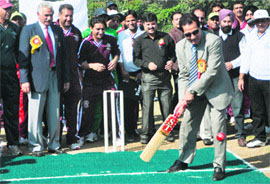 Minister for Youth Services and Sports RS Chib plays a shot during the inaugural ceremony of the All India Vice-Chancellors T20 Cricket Cup in the Jammu University on Monday. 
