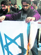 Kashmiri Lawyers burn an Israeli flag in Srinagar on Monday. 