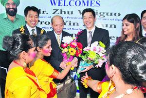 School girls welcoming the Chinese delegation, including Zhu Weiguo, Deputy Director-General of Jiangsu Provincial Department of Education, China, in Patiala on Monday. The team is here on an exchange programme