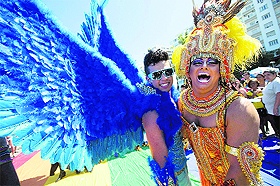 People pose for pictures during the annual Gay Pride Parade in Rio de Janeiro on Monday. 