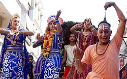 IG (Counter Intelligence) Dr Jitendra Jain (left) flags off the Gopashtami procession that began from Gandhi Market in the city; a tableau taken out on the occasion