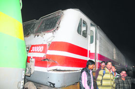 The damaged Nangal-Ambala passenger train near Phase II, Industrial Area; and (below) one of the injured passengers on Tuesday.
