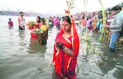 Devotees offer prayers on the occasion of Chhath Puja at the Sector 42 lake in Chandigarh on Tuesday.