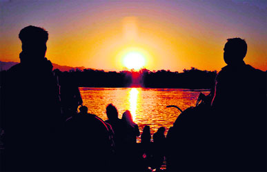  Devotees worship the rising sun on the banks of the Ganga as part of the Chhat puja in Haridwar on Tuesday.