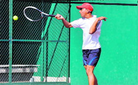 A player in action during the All-India Talent Series Tennis Tournament in Dehradun on Tuesday.