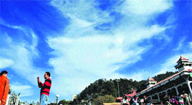 A couple enjoys the cloudy weather in Shimla on Tuesday. 
