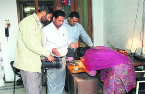 Fingerprint experts look for clues after burglars struck at a factory at Basti Nou in Jalandhar on Monday night.