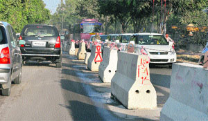 Dividers put up on Ferozepur Road to impose traffic curbs on Tuesday.