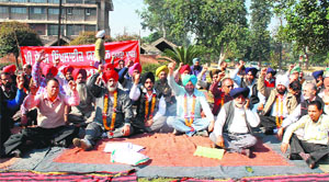 Members of the PAU Employees Union stage a protest in support of their demand for release of arrears on the university campus in Ludhiana on Tuesday.