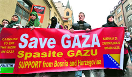 People of Palestinian origin walk through the city centre in support of the Palestinian people after the latest Israeli attacks in Gaza.
