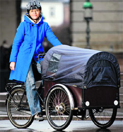 Denmark's Deputy Prime Minister and Minister for Economic and Interior Affairs Margrethe Vestager rides her family bike