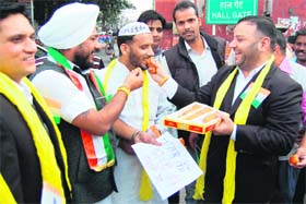 Congress councillor Gurinder Singh and party workers celebrate the execution of Ajmal Kasab, the lone surviving terrorist of the 2008 Mumbai terror attacks, in Amritsar on Wednesday