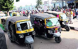 Private auto-rickshaw drivers park their vehicles in the pick up and drop zone that often leads to a traffic jam in the passage.
