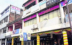 Glazing on upper floors of some shops yet to be removed