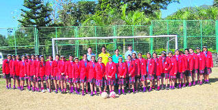 Girl students of Unison World School with two British coaches, who have come for an orientation camp to Dehradun.