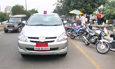 Mayor Sunil Jyoti's official car parked in the middle of the road in front of the DC office during the BJP dharna in Jalandhar on Wednesday. 