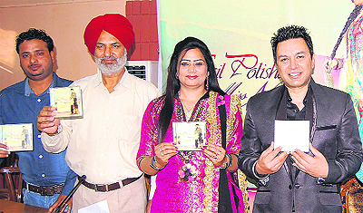 Punjabi singer Manmohan Waris releases the album "Nail Polishan" of singer Miss Neelam in Jalandhar on Tuesday.